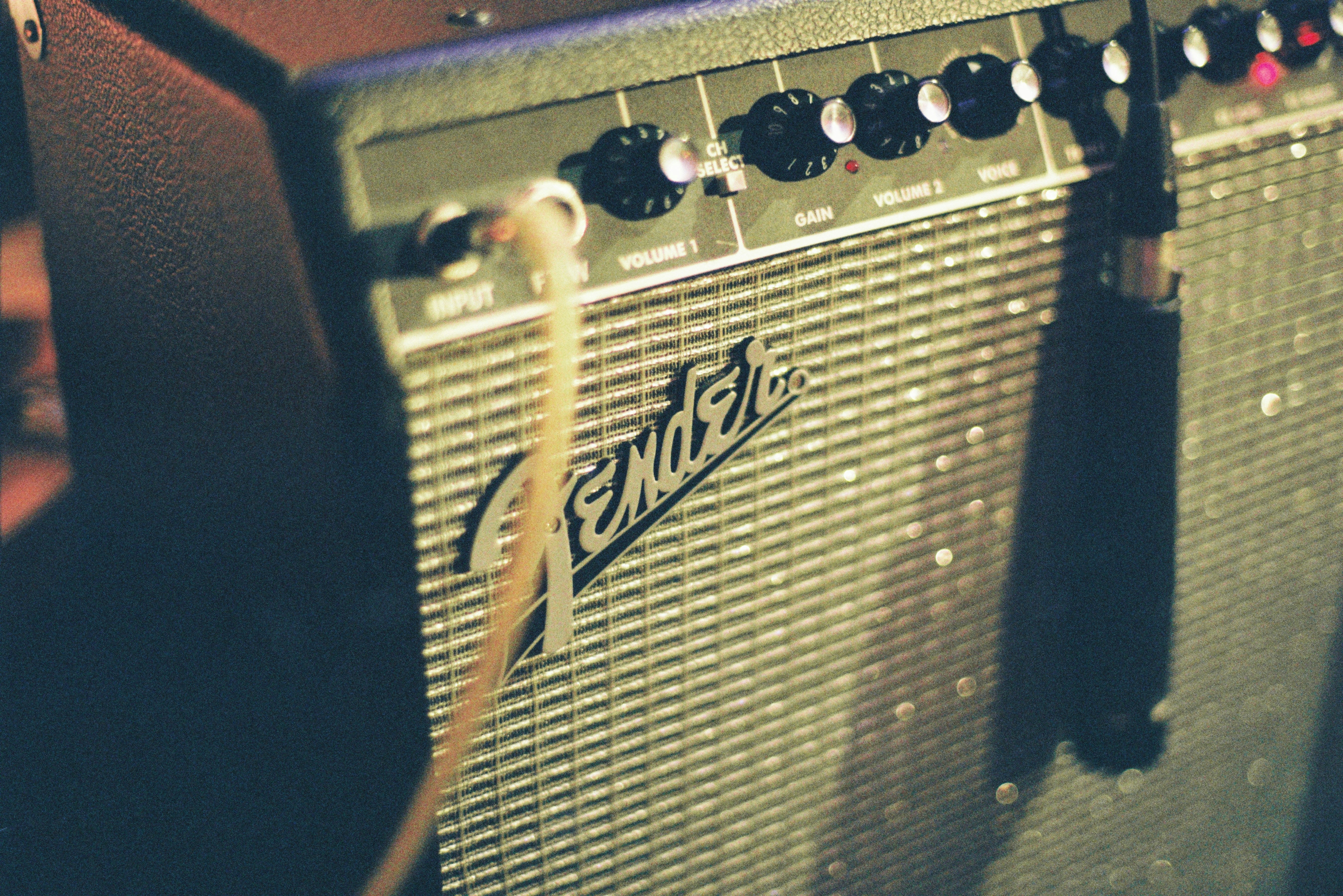Fender guitar amplifier close-up in a recording studio — analog hardware as the benchmark digital plugins are measured against